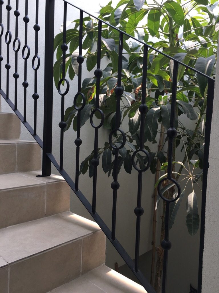 A staircase with a tree behind it, inside my house in Mexico.