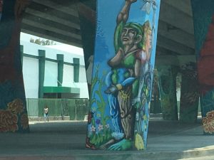 A mural underneath a bridge. 