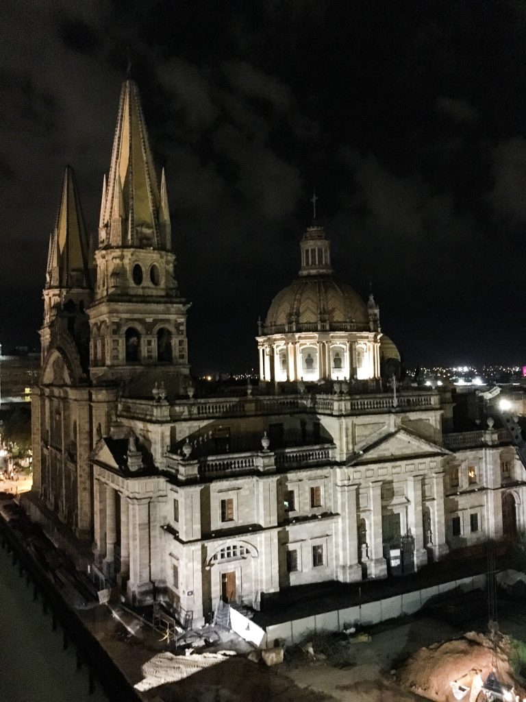 A beautiful, old church lit up at night.