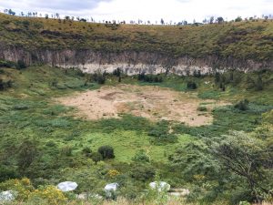 The Crater La Alberca today. It's empty of water and full of green plants.