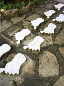 a stone walkway, with raised foot "prints".