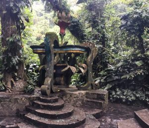 Cement artwork that resembles a fountain, surround by the jungle at Las Pozas.