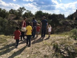 Several people standing on the edge of the Santa Brígida mine