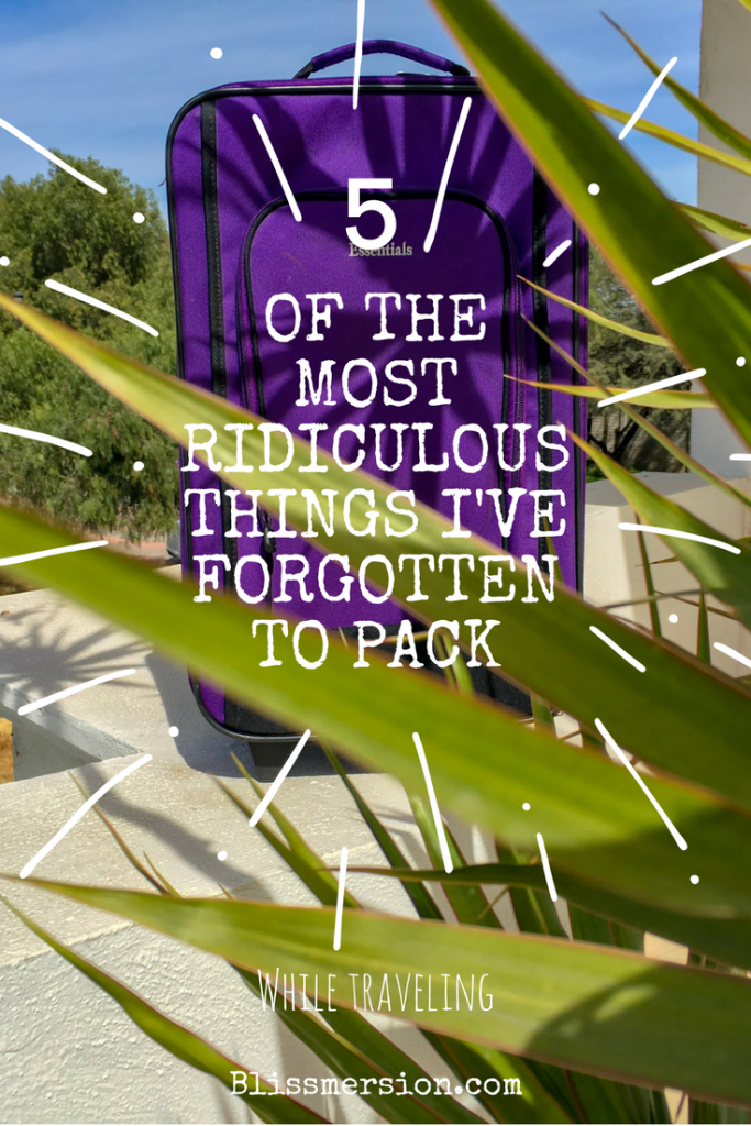 A purple suitcase sits on a white ledge, with green trees and blue sky behind it. Packing for a trip with kids around can lead to some unfortunate forgotten items. Here are some of the most ridiculous things I have forgotten for our travels. #packingtipsfortravel #travelwithkids #failedit #blissmersion