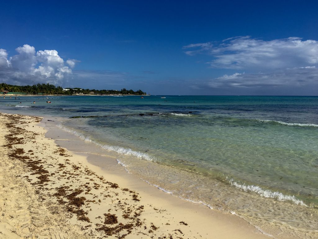 a beach and ocean view from one of the Playa del Carmen resorts