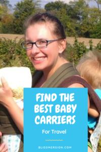 Woman, using baby carriers to have a baby on the front and a toddler on her back. She is smiling. Find the best baby carriers for travel (words from the image)