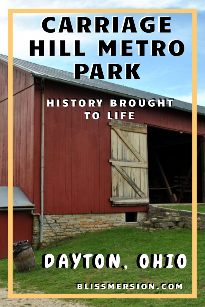 A red barn delights vistors of Carriage Hill Metro Park and Arnold Farm, located in Dayton, Ohio. Surrounded by lush green in season, the farm also has livestock. Get outside with your family and visit! #travelwithkids #Blissmersion #carriagehillmetropark #dayton #daytonohio #ohio #daytonmetroparks